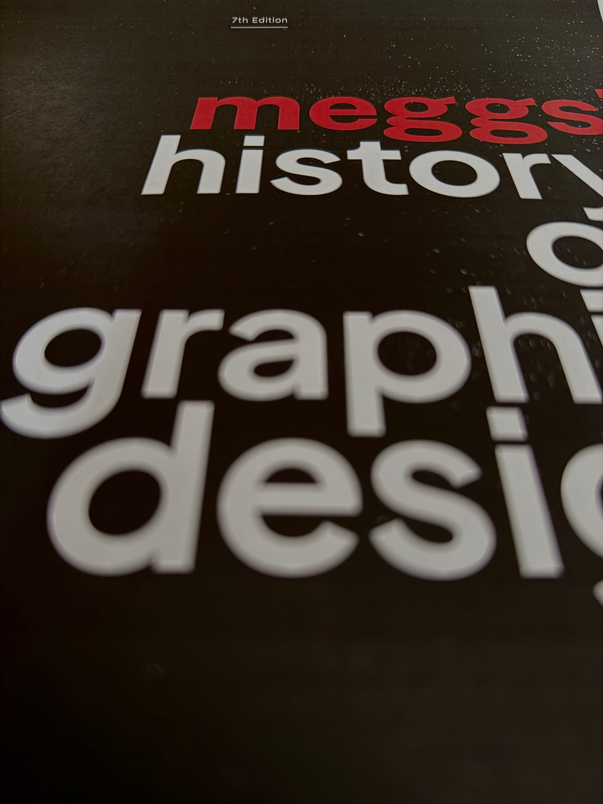 perspectival image of book cover that says Meggs' History of Graphic Design